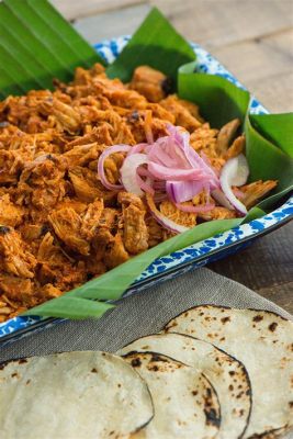  Cochinita Pibil: Uma explosão de sabores caribenhos em um banquete de porco assado à perfeição!